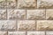 Stone background, sand wall pattern texture. Yellow natural stone facade, wall tiles.