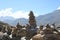 Stone Balancing, a Stack of Stones with Scenic Mountain Landscape