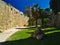 Stone balls palm trees and medieval fortifications