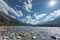 Stone bank at flowing river lech in tirol