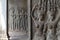 Stone bas-relief with human figure in Angkor Wat, Siem Reap, Cambodia. Devata bas-relief closeup in ancient temple.