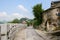 Stone battlements on side of way in ancient town on sunny spring