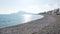 Stone beach with view on sunny Altea coastline and mountains, Costa Blanca, Spain