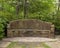 Stone bench constructed by the New Deal Works Progress Administration in the 1930`s in Turtle Creek Park, Dallas, Texas.