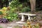 Stone Bench Hidden in Flower Garden