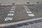 Stone blocks prevent traffic from entering cars or direct traffic outside the pedestrian zone, white stripes mark the crossing poi