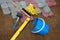 stone blocks rubber hammer level gloves and tape measure