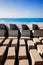 Stone blocks on a seawall of a port breakwater on the Atlantic coast on a sunny day