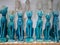 Stone blue figurines of Egyptian cats are sold in a souvenir shop. Selective focus. Luxor, Egypt