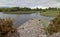 Stone boat dock of ancient castle ruins McCarthy Mor on Lake Lough Leane at Killarney on the Ring of Kerry in Ireland