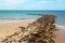 Stone breakwater and sandy beach- Cadiz, Spain