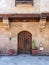 Stone bricks wall with arched wooden door of house of Moustafa Gaafar Al Selehdar, Cairo, Egypt