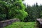 Stone bridge crossing green fields of Soria