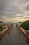 A stone bridge that leads to a place to enjoy the sunset on Royal Island, Indonesia. Surrounded by mangrove forests with beautiful