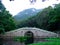 A stone bridge over a lake