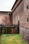 Stone bridge with railings near the wall of the Castello Sforzesco. Milan, Italy