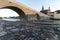 Stone bridge and skyline of Regensburg with selective focus on foreground