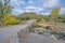 Stone bridge with a view of field of saguaros and mountain at Sabino Canyon State Park in Tucson, AZ