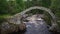 Stone bridge and waterfall in Carrbridge