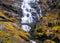 Stone bridge and waterfall on troll road in Norway