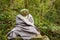 Stone Buddha statue wearing scarf and cap.