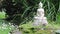 Stone buddha in a zen garden