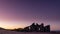 Stone building ruins in the Idaho desert at sunset