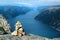 Stone cairn over Lysefjord and Preikestolen rock, Norway