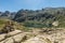 Stone cairn overlooking Lac de Melo in mountains of Corsica