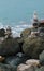 Stone cairn on seacoast. Big rocks and balanced pebbles stack.