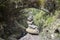 Stone cairn under the bridge, Rabacal, Madeira island, Portugal