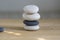 Stone cairn on wood background, stones tower, simple poise stones, simplicity harmony and balance, black and white pebbles