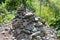 a stone cairn in the woods