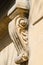 Stone carved corbel  under the window of an old building