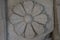 Stone carving depicting floral patterns on an ancient roman wall