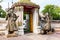 Stone carving giants infront of the gate of Wat Pho in Bangkok