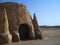 Stone castle in the desert. Dunes