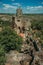 Stone castle and tower over rocky cliff