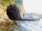 Stone cave at the Muriwai beach, while sunset.