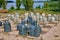 Stone chess pieces on the ground. Stylized chess Board with stone chess pieces outdoor in the park