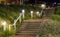 Stone city staircase going up with light lanterns urban cityscape scenery of the streets at night