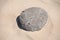 Stone on clear sand in beaches of Valdevaqueros  , Tarifa in CÃ¡diz.