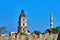 Stone Clock Tower and Turkish minaret behind the medieval defensive wall