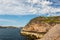 Stone coastline of Barents sea, rocks covered with moss and lichen. Northern polar summer in the tundra. Arctic ocean