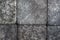 Stone cobblestones, background close-up. Natural texture. Dark gray backdrop or wallpaper. Rough surface. Aged effect shot.