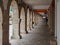 Stone colonnade on the main street, Rua de Compostela - Portomarin, Galicia, Spain