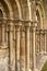 Stone columns and figures carved on a medieval abbey ruin.