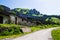 Stone construction, road and rocks on background