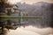 Stone cottage on lake, brown colors, peaceful atmosphere