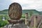 Stone with a cross above the valley